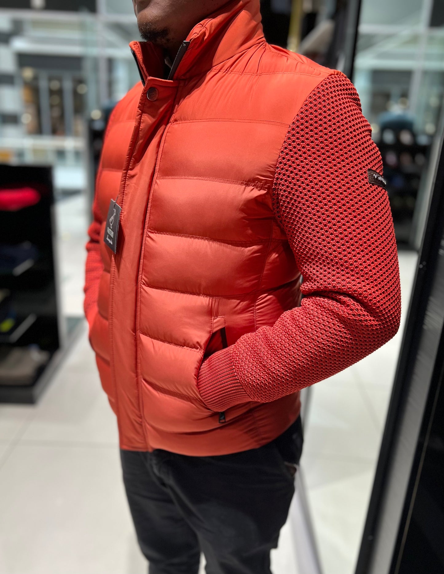 ORANGE VATURI PUFFER WITH RED SLEEVES