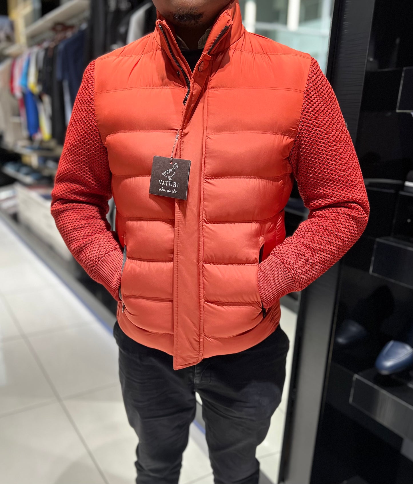 ORANGE VATURI PUFFER WITH RED SLEEVES